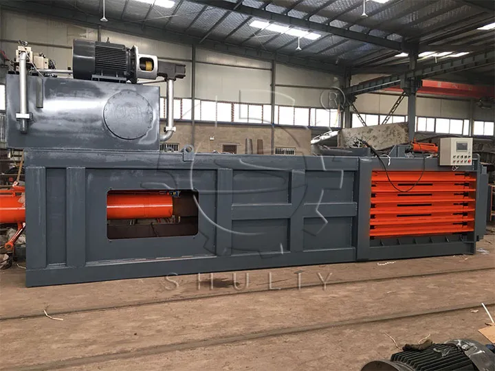 Hydraulic tire baling machine